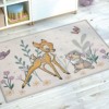 Covor Disney pentru copii cu Bambi și Thumper, în culori bej, verde și mov, dimensiune 80x120 cm, cu desene animate detaliate și motive florale.