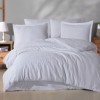 Lenjerie de pat de lux din jacquard satin, Clasy Home, model Arte, în nuanțe de alb cu design floral sofisticat.