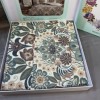 Lenjerie de pat din bumbac 100% ranforce model Valeria cu design floral detaliat în nuanțe de bej, verde și maro.