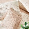 Lenjerie de pat dublu bumbac 100%, TAC Reborn, Ginny, design floral portocaliu pe fundal crem, 4 piese, dormitor elegant și sustenabil.