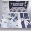 Lenjerie de pat dubla cu elastic din bumbac 100% reversibila model flori albastre bleumarin elegant, 4 piese, fabricata in Romania