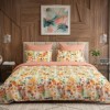 Lenjerie de pat dubla cu elastic din bumbac 100% reversibila model flori si frunze colorate, 4 piese, fabricata in Romania