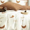 Set lenjerie de pat finet 6 piese cu stele si luna bej- caramel pe fundal crem, cearceaf pilota 200x220 cm