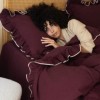 Lenjerie de pat flanel Josef cherry bordo First Choice, model uni cu volane decorative si contur crem
