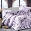 Lenjerie de pat dublu colecția Dream Nazenin Home cu 4 piese și design floral și geometric în nuanțe de lila și negru pe fundal lila.