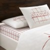 Set lenjerie de pat dublu Rometa TAC din bumbac 100 % ranforce, imprimeu LOVE cu efect fosforescent pe fond alb