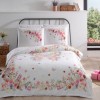 Lenjerie de pat din bumbac 100% ranforce model Victoria cu design floral fosforescent în nuanțe de roz, portocaliu și verde.