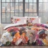 Lenjerie de pat satin de lux cu flori multicolore în nuanțe de portocaliu, roz, mov și albastru pe fundal alb TAC Moise