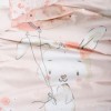 Set lenjerie pătuț Rapeti Somon Cotton Box din bumbac 100 % ranforce, fundal roz pudră cu iepuraș și balon-umbreluță