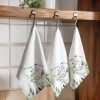 Prosop de bucătărie Gizmo din bumbac 100%, cu design festiv de Paște, decorat cu iepurași și frunziș verde.