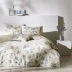 Lenjerie de pat dublu bumbac 100%, TAC Reborn, Gaia, design floral verde și mov pe fundal crem, 4 piese, dormitor elegant și sustenabil.