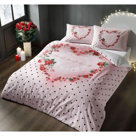 Lenjerie de pat dublu bumbac 100% Ranforce Tac Lover fosforescentă cu imprimeu floral și buline negre pe fundal roz, strălucind în întuneric.