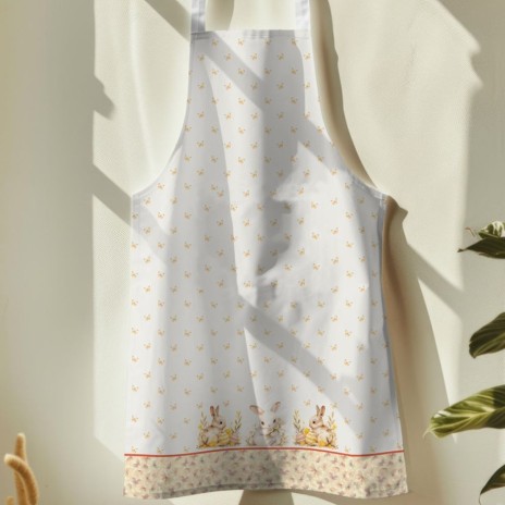 Sort de bucătărie Ginny din bumbac 100%, decorat cu iepurași și flori delicate, ideal pentru un decor festiv de Paște.